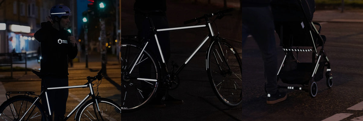 Vélos et poussette équipés des bandes réfléchissantes REFLECTIVE Berlin Stripes, la nuit à Berlin