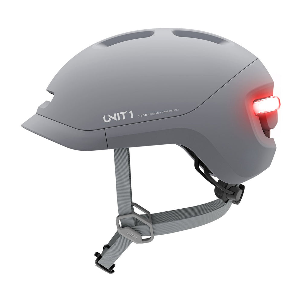 Casque connecté Unit 1 NEON Mips, coloris Mineral Gray, vue de profil, feu arrière allumé