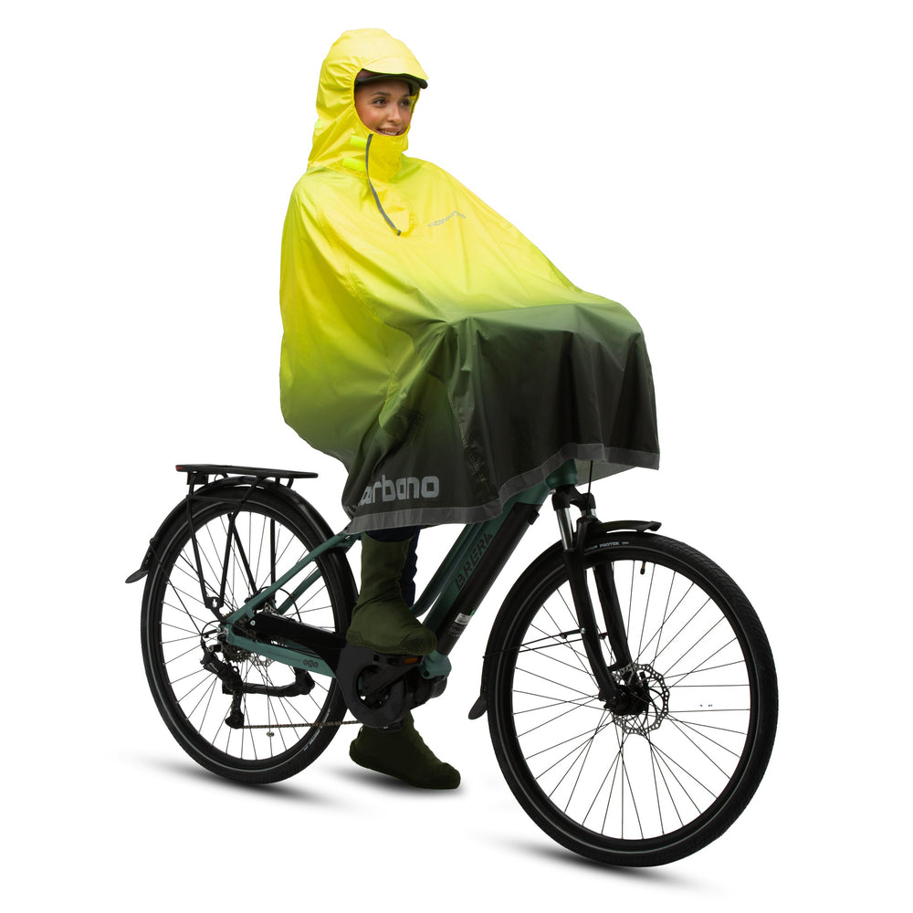 Cape de pluie vélo Tucano Urbano Garibaldina Zeta Color jaune fluo et anthracite vue de trois quarts arrière sur le vélo